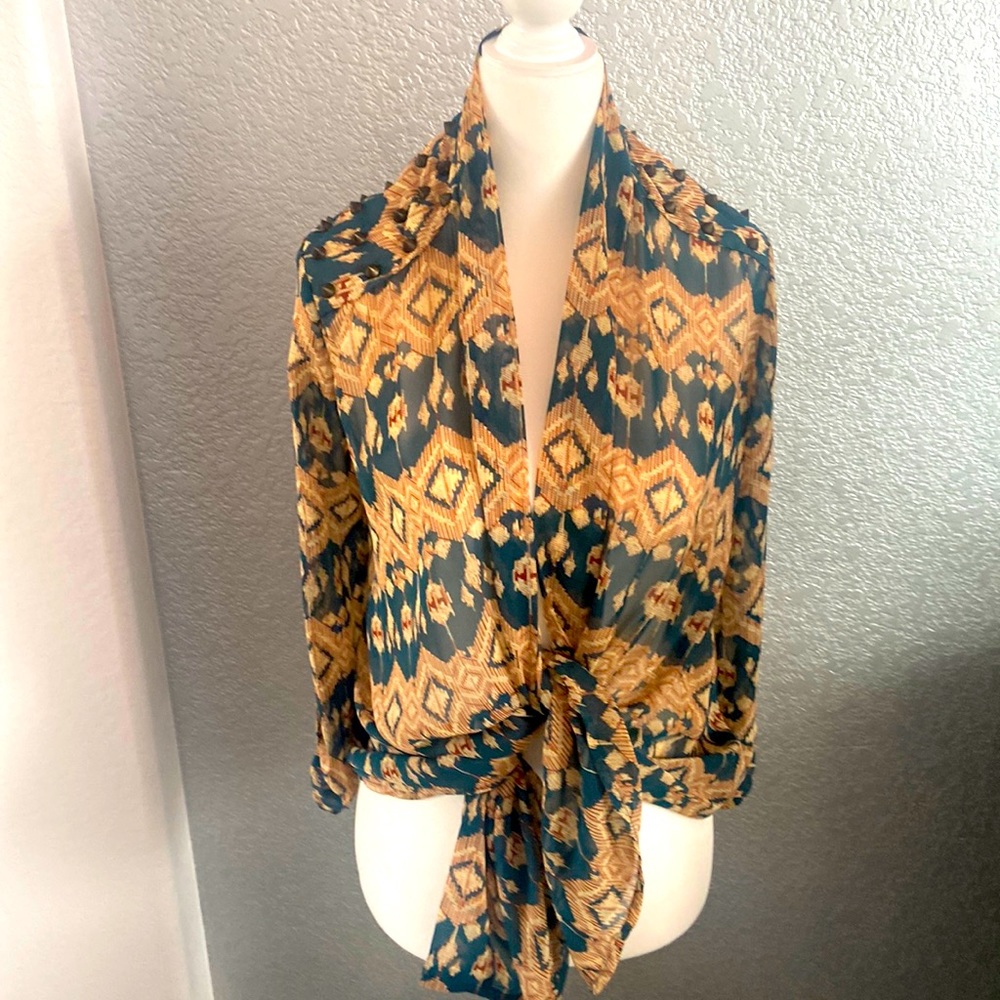 Sheer poly southwest style shirt.  Can tie or belt.